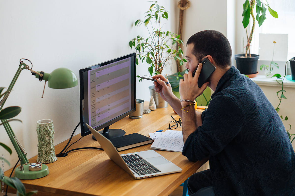 Person working at desk with security monitoring